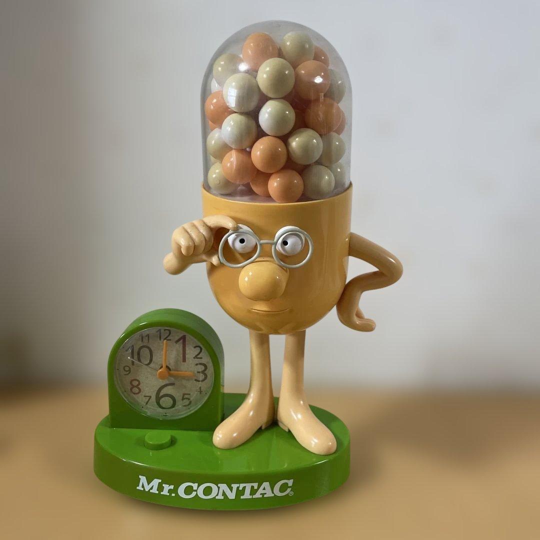 「Mr. Contac 」人形　土台　緑　目覚まし時計付き　高さ30cm