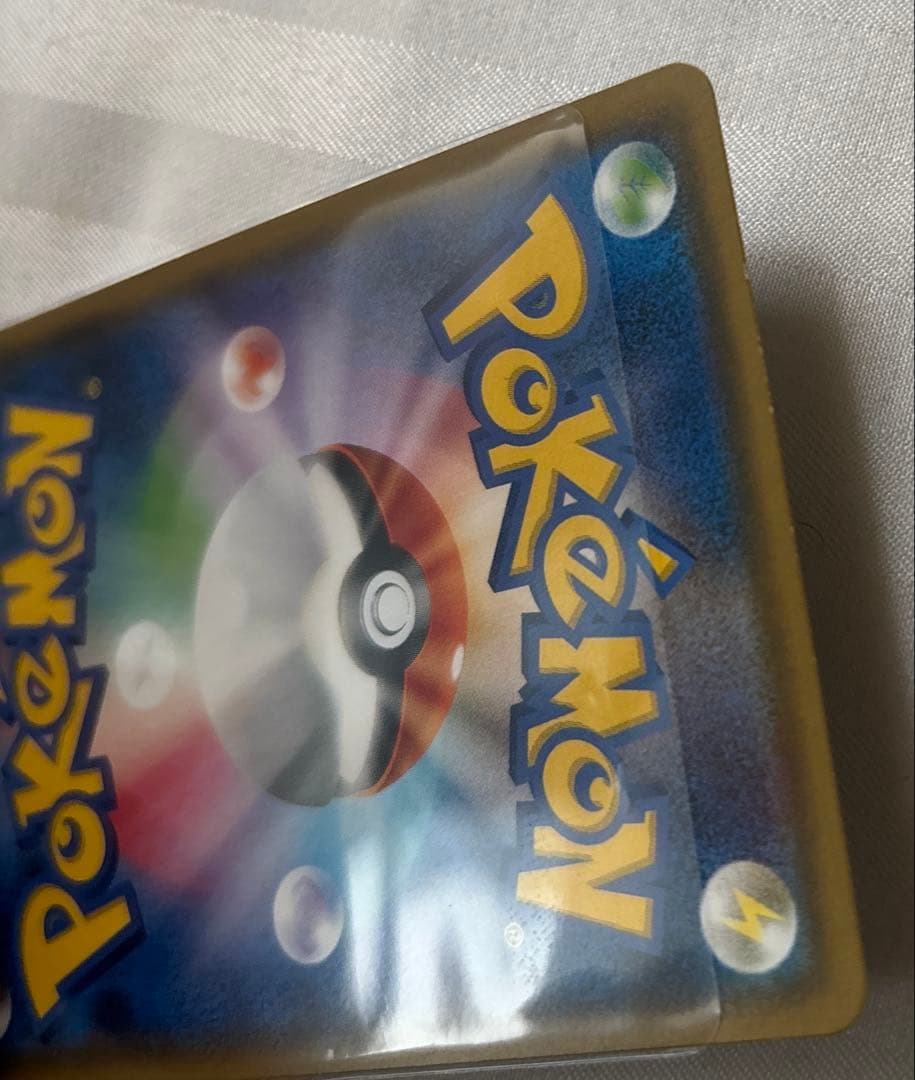 ポンチョを着たイーブイ ブラッキー プロモ 141/SM-P