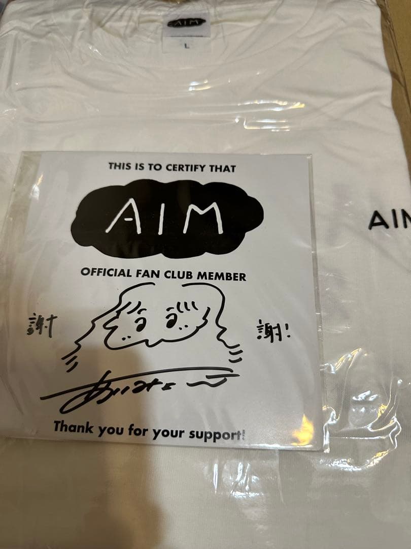 AIM 限定ミニサイン付きTシャツ