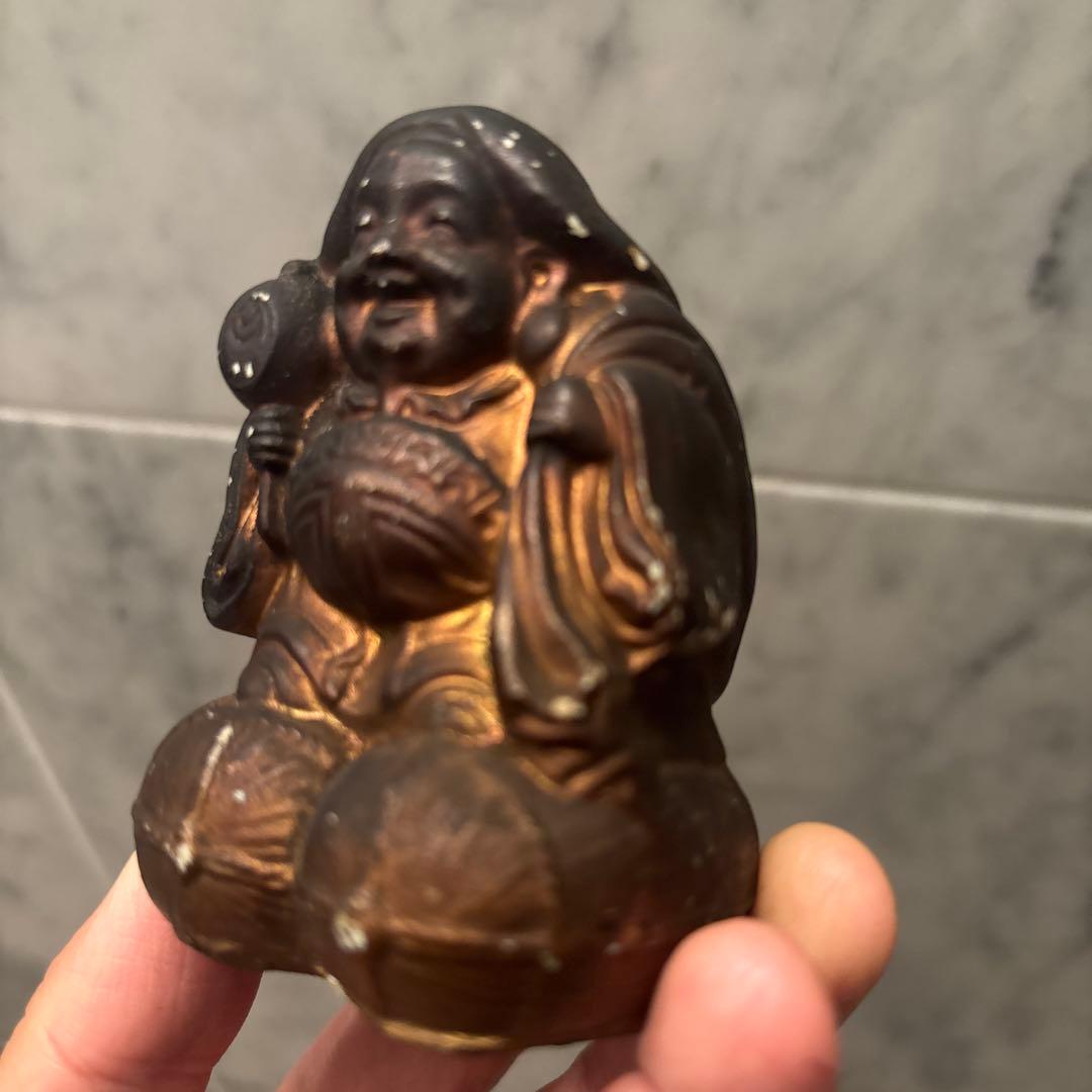 アンティーク明治時代平和的なお顔で 笑顔が素敵な大黒様の陶器オブジェ