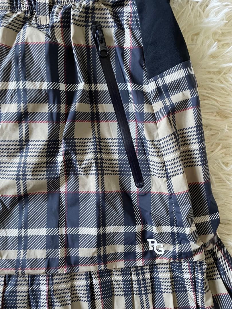 パーリーゲイツ 【軽量保温】バックロゴプリーツ切替タフタスカートサイズ0