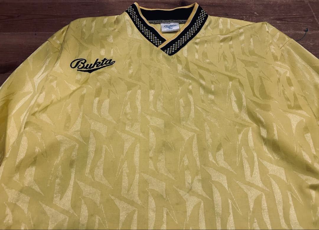 ユニフォーム 古着 90s Bukta バクタ UK製 黄色 Vネック 40
