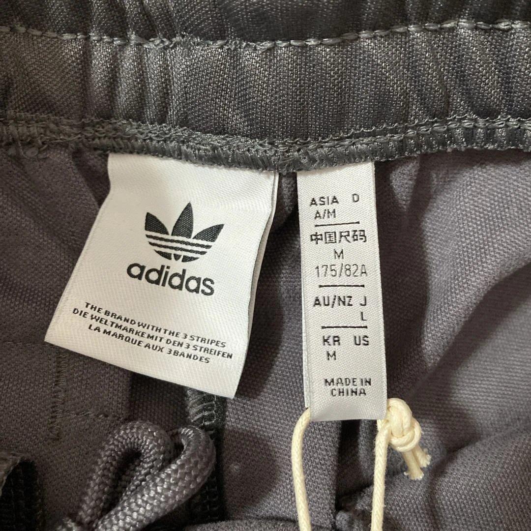 新品未使用タグ付き‼︎マンチェスター×adidasトラックパンツ　ジャージLサイズ