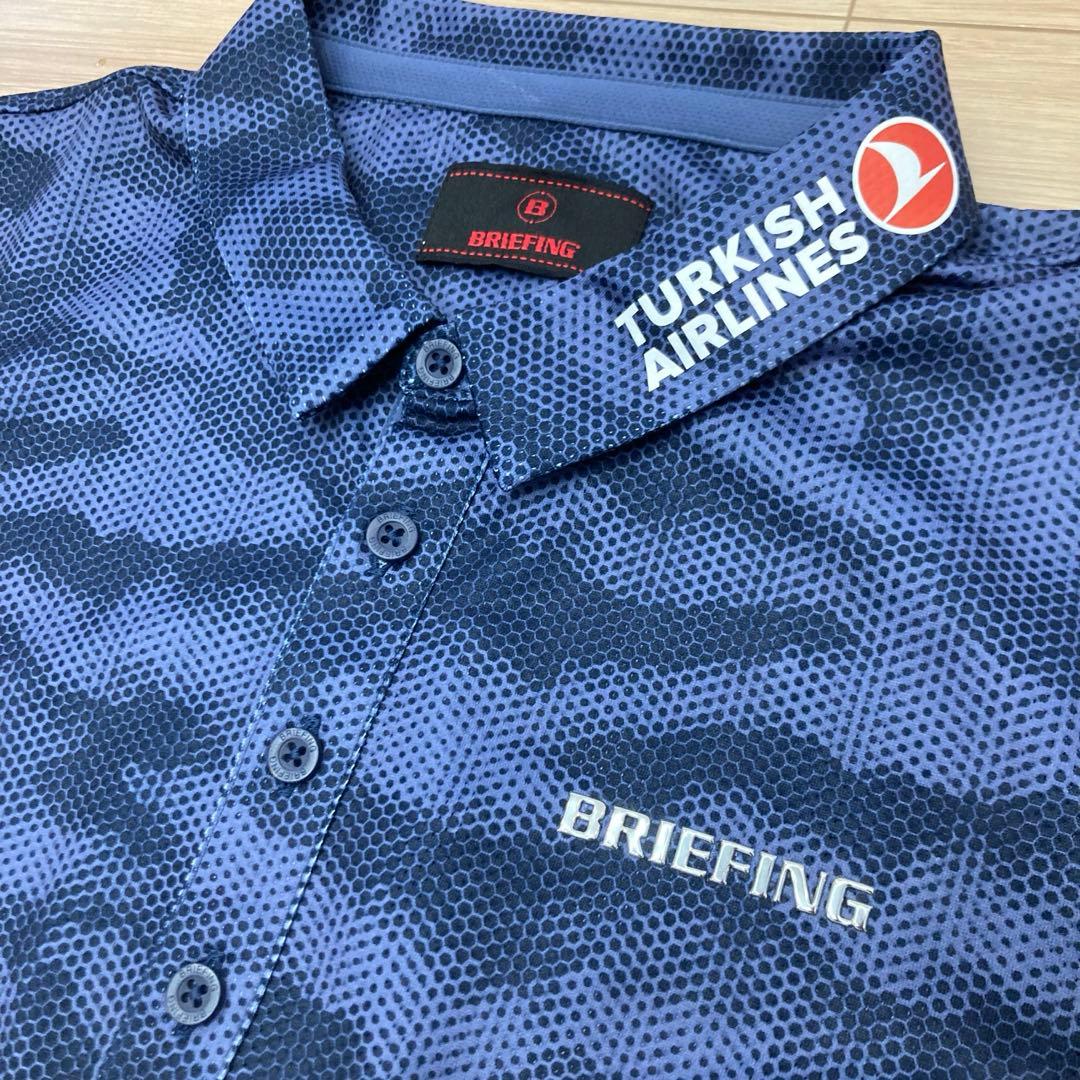 ゴ*ン様 BRIEFING ポロシャツ メンズ カモフラ柄 企業ロゴ入