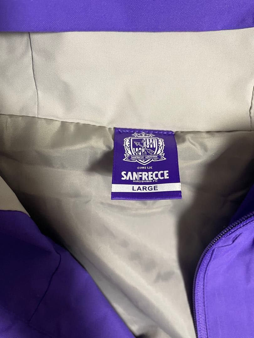 サンフレッチェ広島　ウィンドブレーカー（ルモスアロー） バイオレット