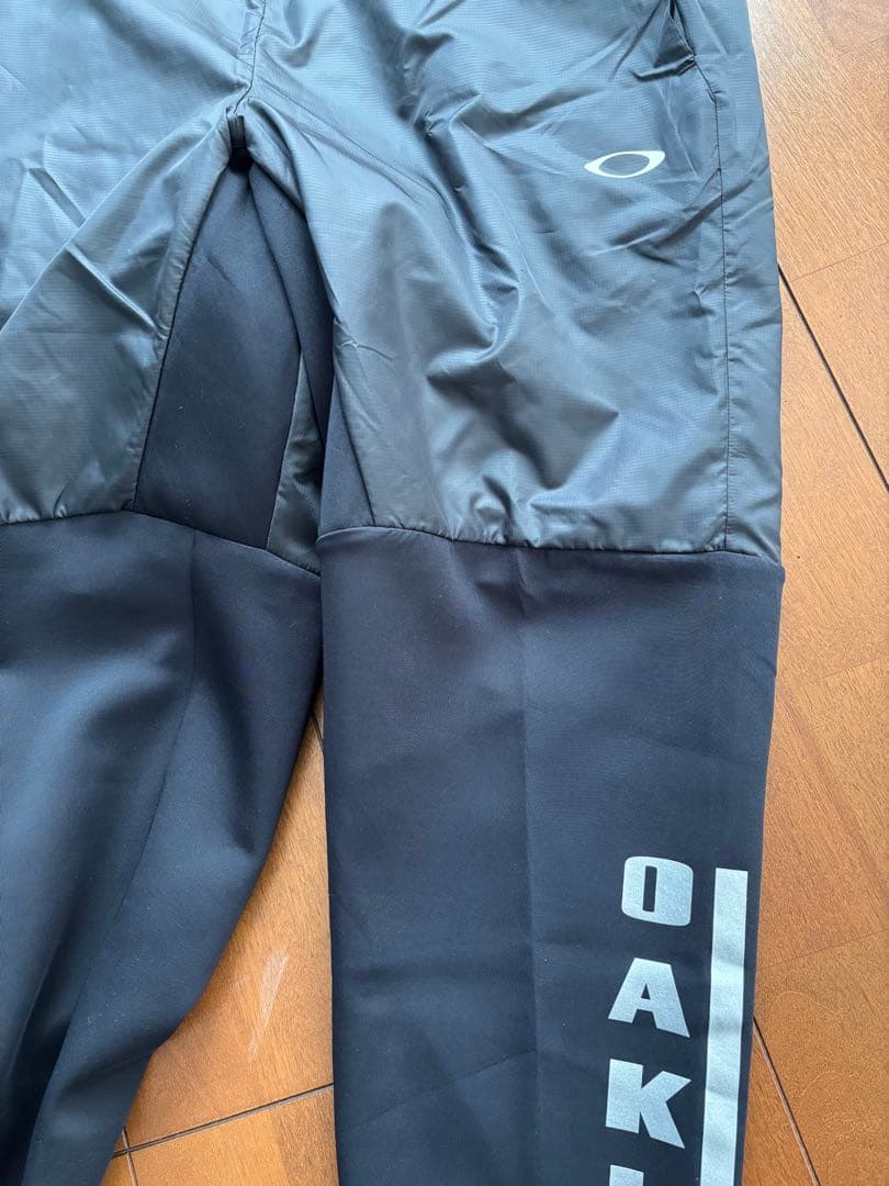【新品未タグ付】オークリー ウインドブレーカー（上L・下M）保温 撥水 静音機能