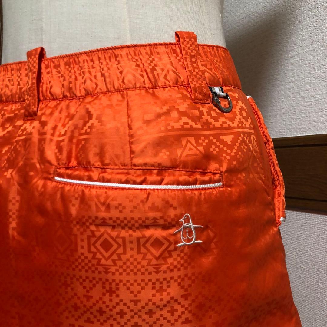 セットアップ マンシングウェア 中綿 パーカー スカート オレンジ 総柄 M