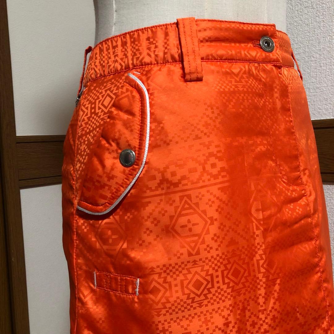 セットアップ マンシングウェア 中綿 パーカー スカート オレンジ 総柄 M