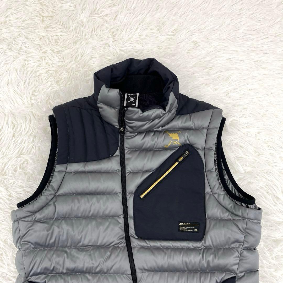 【美品】オークリー・ゴルフウェア・ダウンベスト・アシンメトリー・ロゴプリント・M