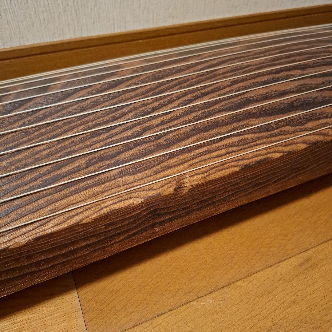 オレンジ色の鶴模様の袋つき　　　お琴