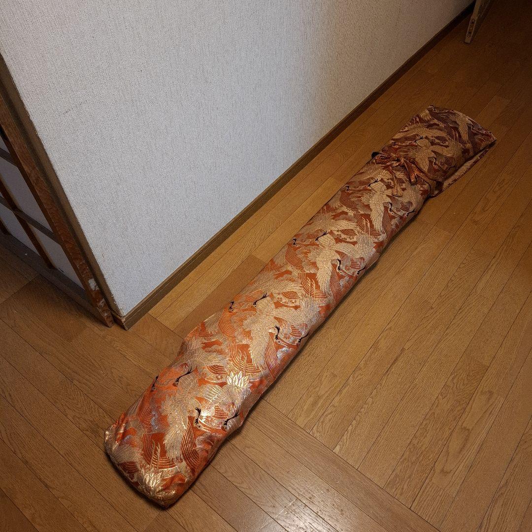 オレンジ色の鶴模様の袋つき　　　お琴