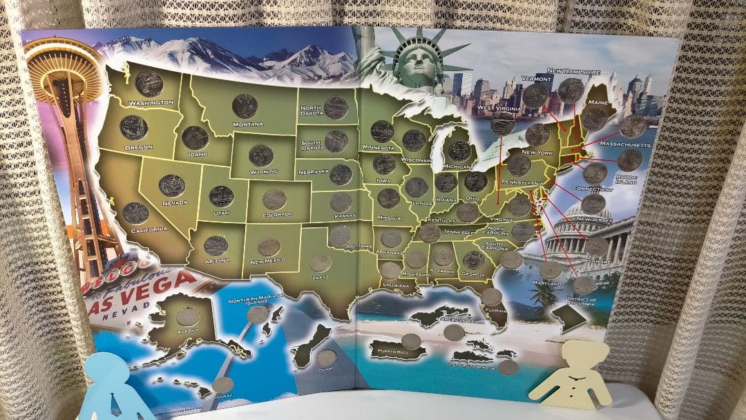 ♥♥。アメリカ25セントクォーター50州記念アルバム(56枚在中)。