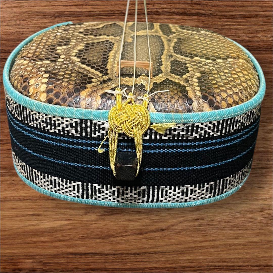 【ネッシー】沖縄三線 蛇本革布生地ソフトカバー＆弦３本＆駒