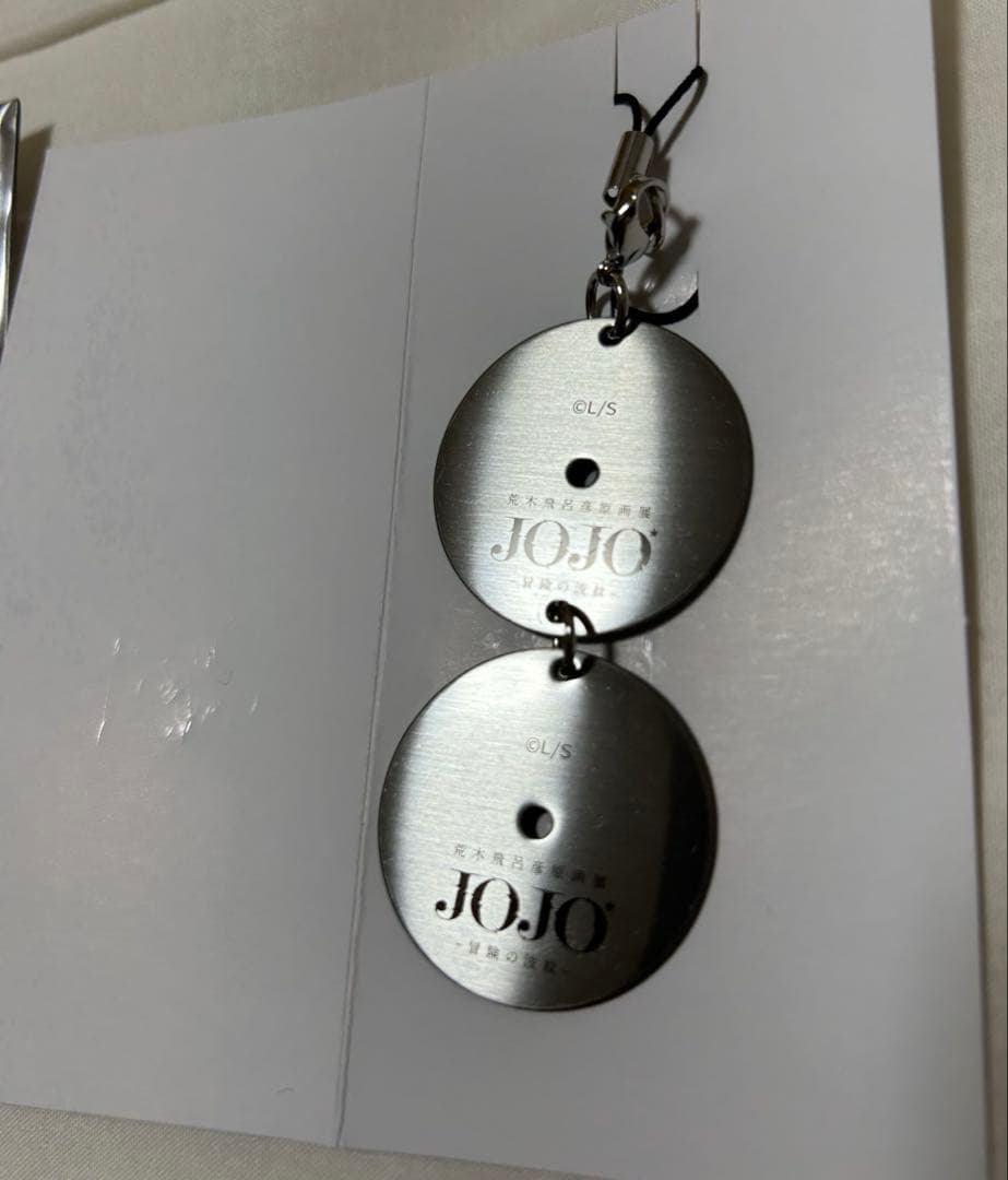 ジョジョ展 メタルDISC型 キーホルダー 限定品 荒木飛呂彦 原画展 空条徐倫