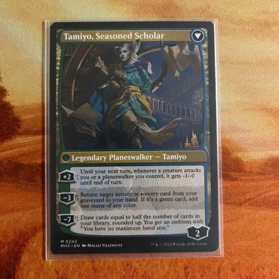 知りたがりの学徒、タミヨウ/ 老練の学匠、タミヨウ [MH3] 青R 英語版