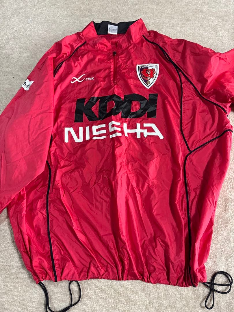 KDDI NIESHA ピステ・ウィンドブレーカー 赤