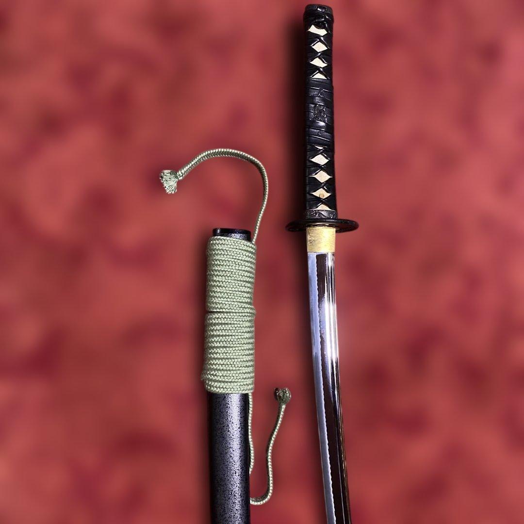 豪華居合刀 黒革巻柄 鶴松図楕円鍔 黒梨地鞘