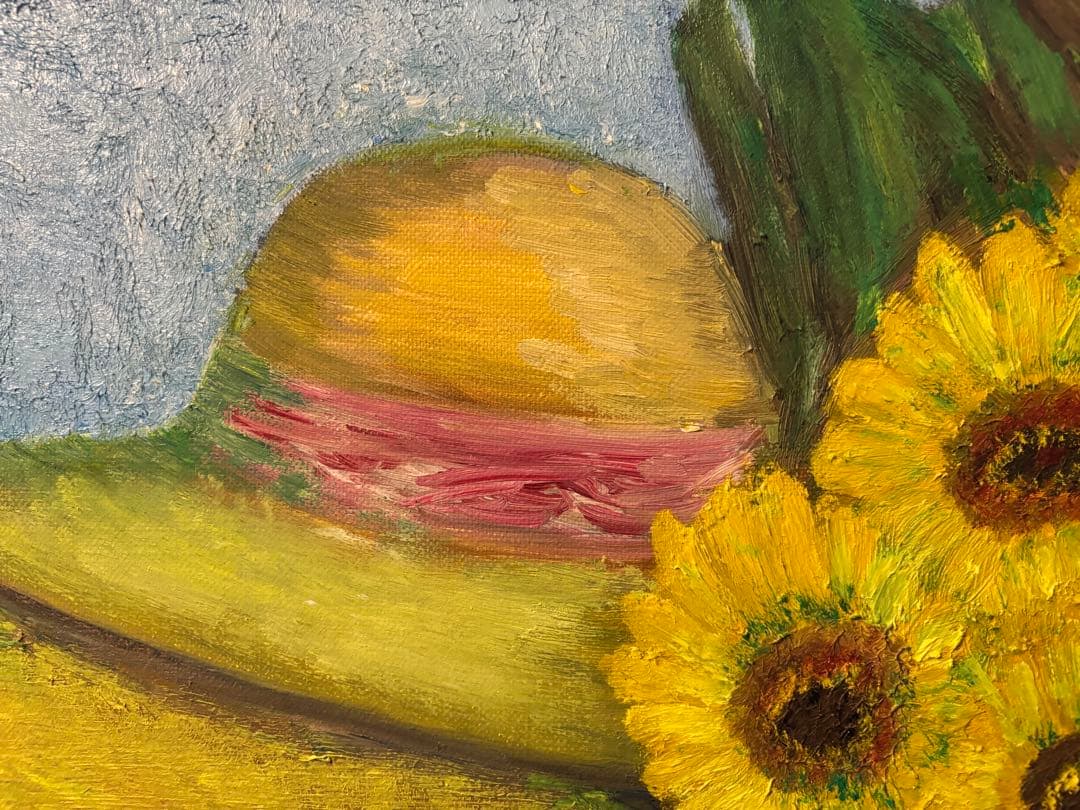 ひまわりと麦わら帽子