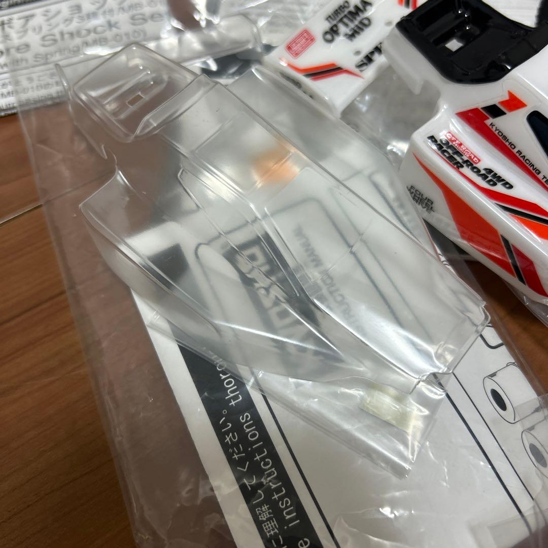 タカクワツトム