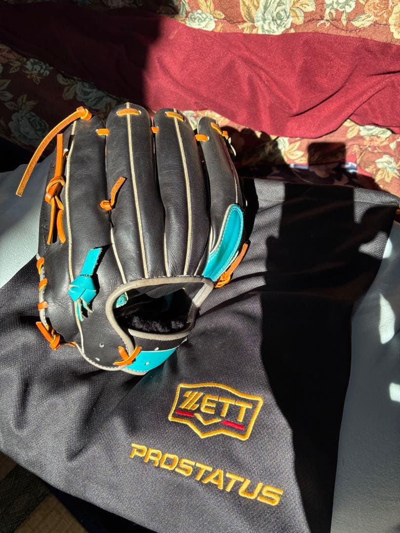 ZETT PROSTATUS 軟式グローブ 黒/青/オレンジ