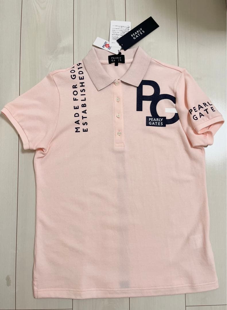 新品タグ付き　即完売さくら色ポロシャツ　スカートも出品してますよー