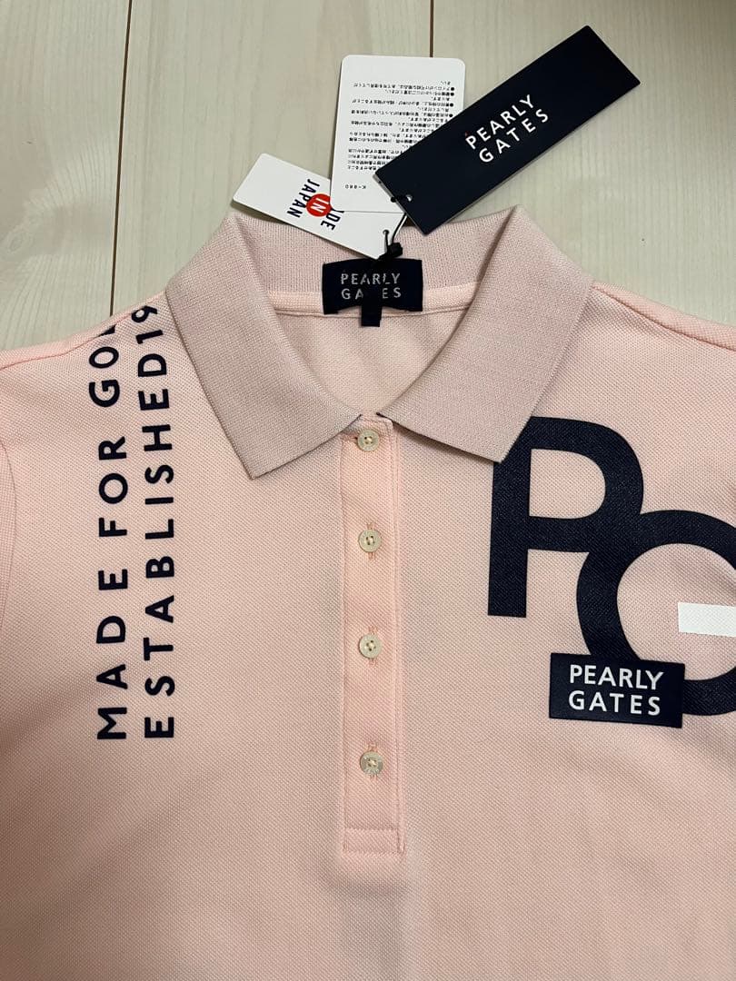 新品タグ付き　即完売さくら色ポロシャツ　スカートも出品してますよー