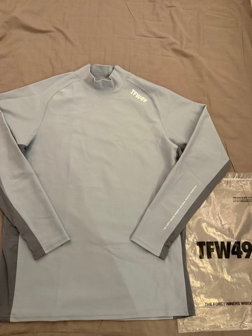 メンズウェア TFW49 LS MOCKNECK L.BLUE L