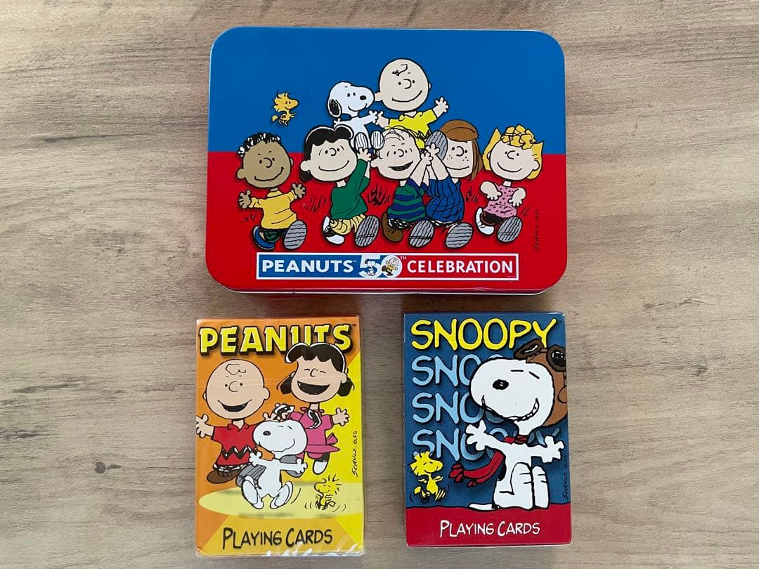 ピーナッツ生誕50周年記念アニバーサリーコレクター缶（トランプ2組付)スヌーピー