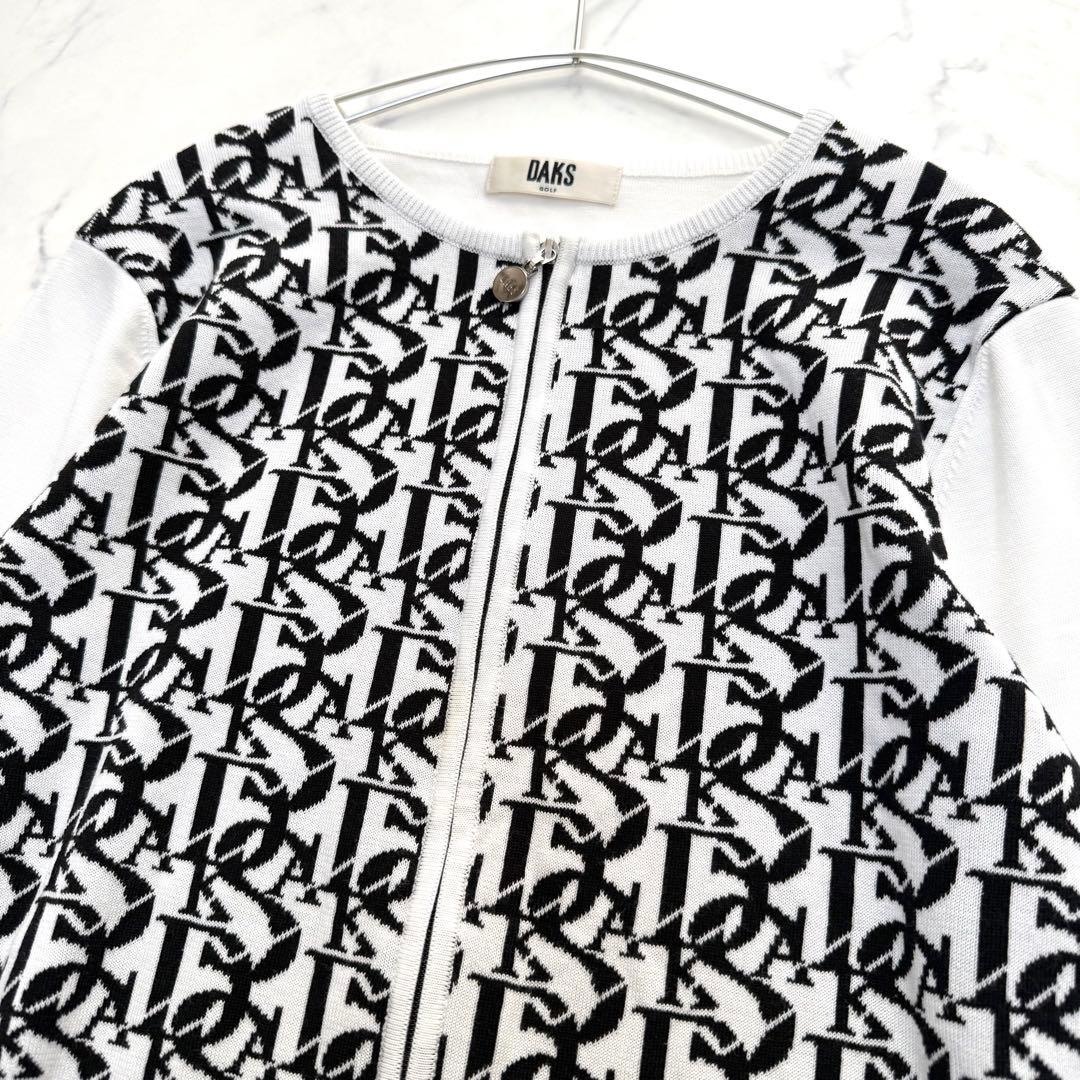 【ダックスゴルフ】ニットセットアップ　カーディガン　スカート　ロゴ柄　ホワイト