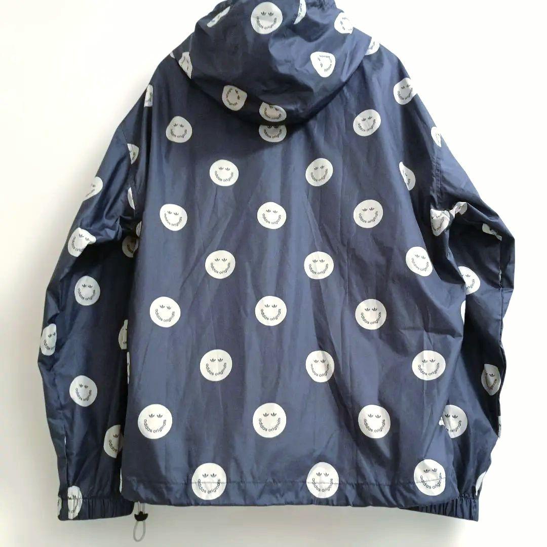 アディダスadidasプリントウィンドブレーカースマイリーフェイス
