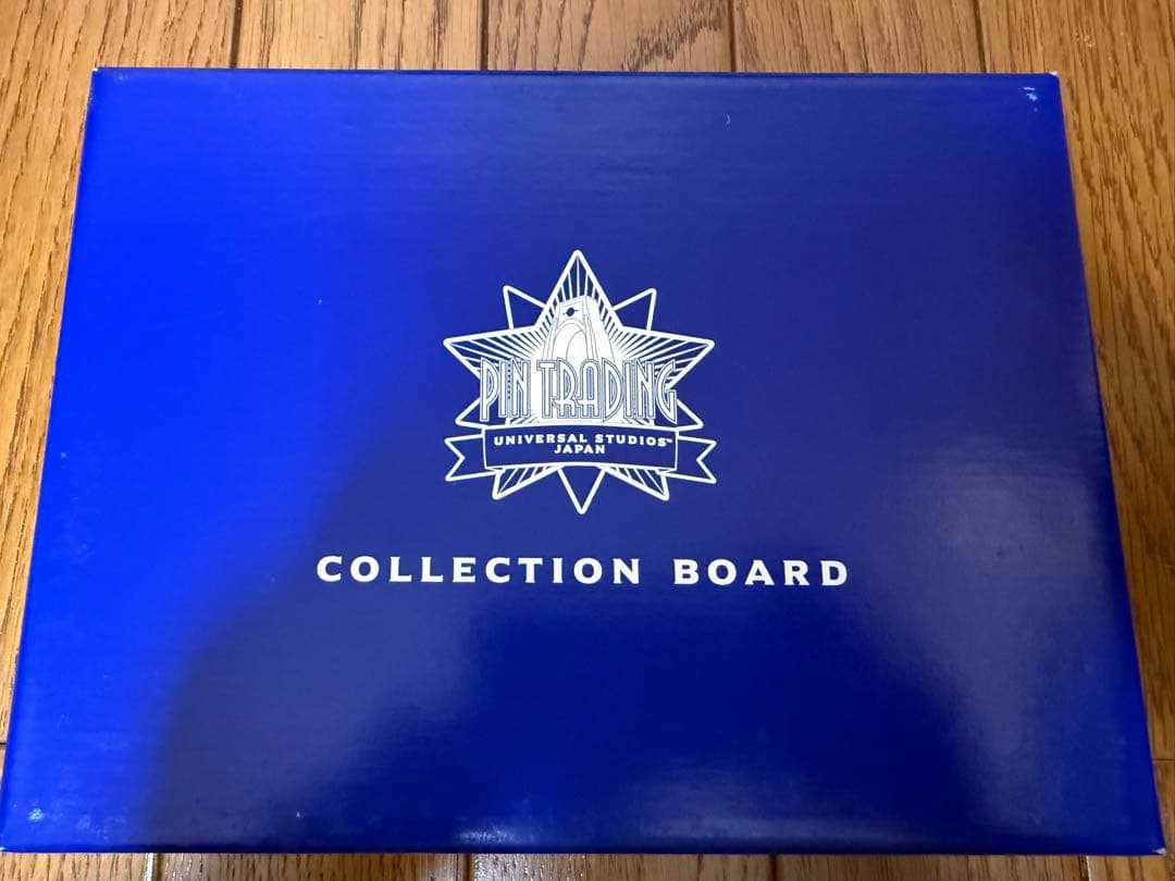 USJ1周年記念ピンバッチ7種とピントレ記念ピンバッチ付きコレクションポード