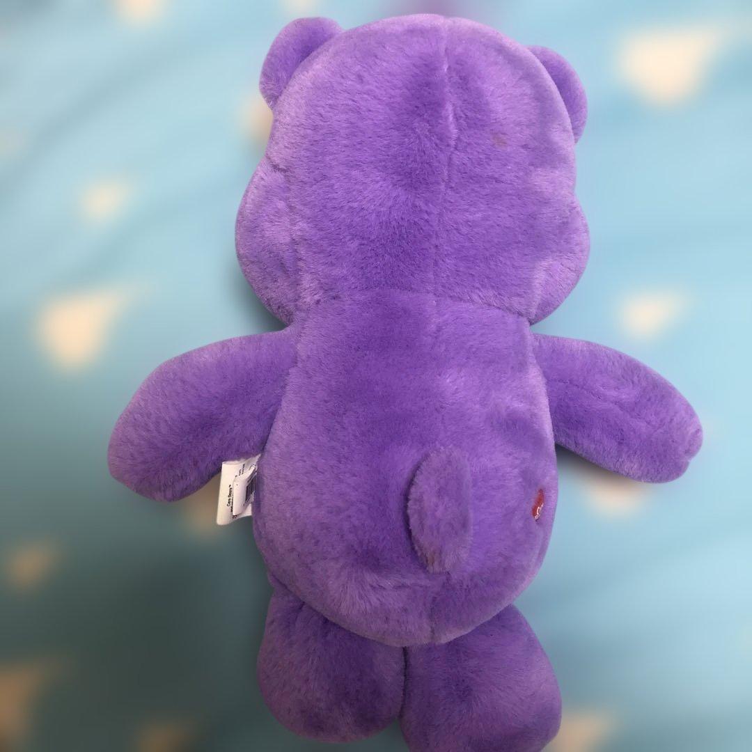 紫色のケアベアぬいぐるみ