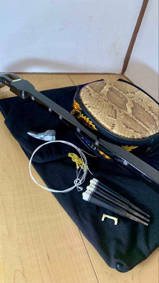 三線 沖縄 両面蛇皮 表側強化二重張り カラクイ1本弦2本新品交換