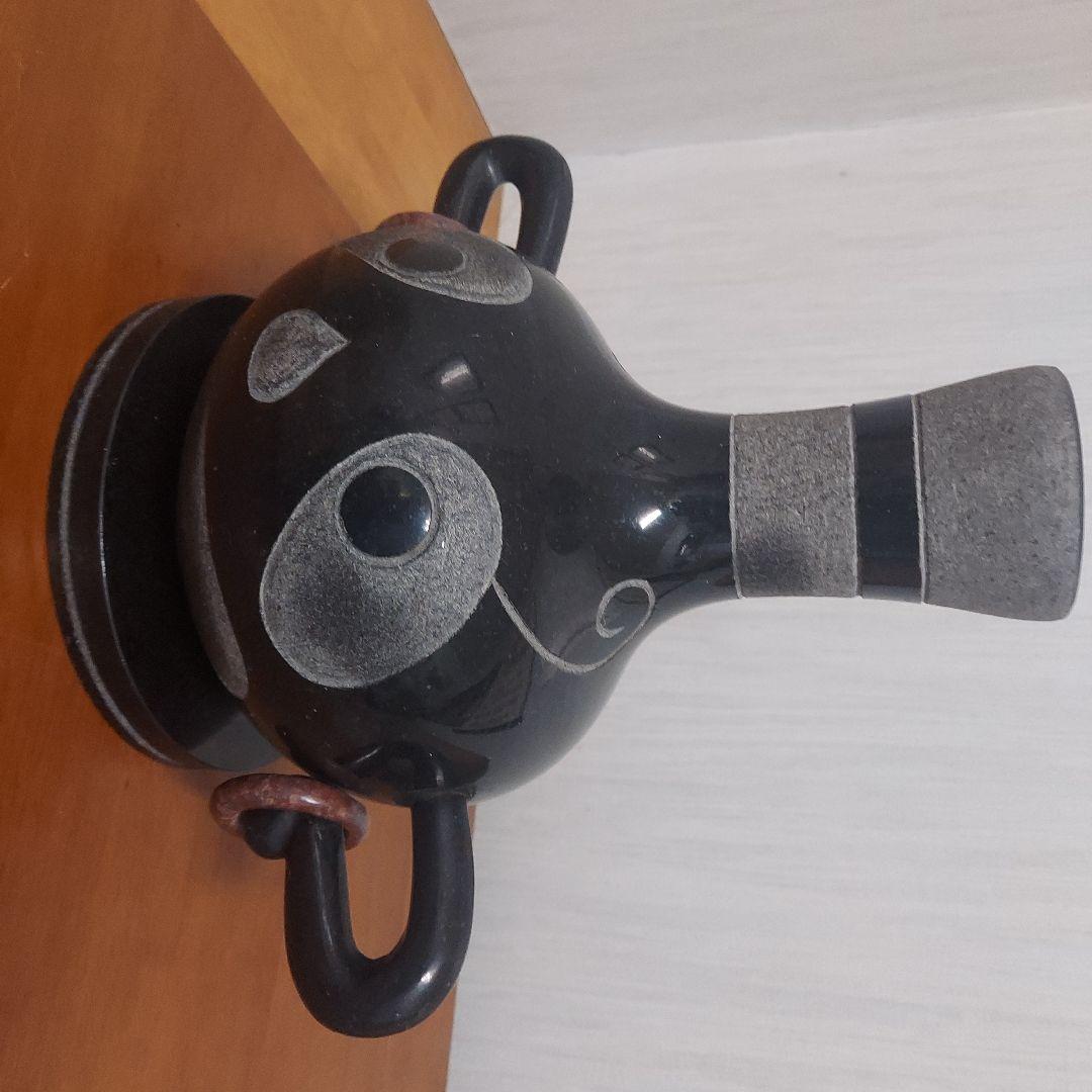 顔の形の黒色石製品置物25㎝