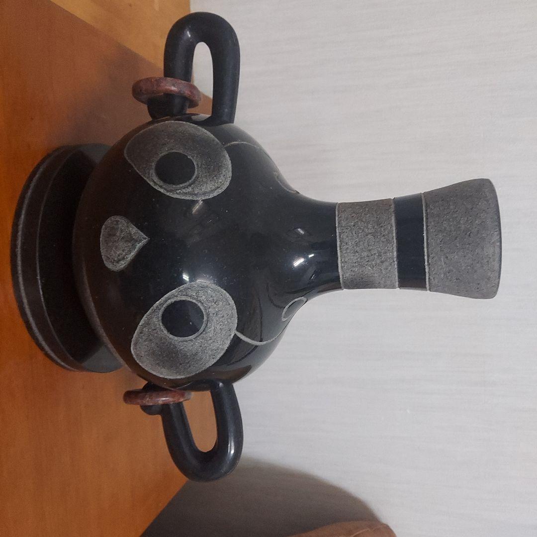 顔の形の黒色石製品置物25㎝