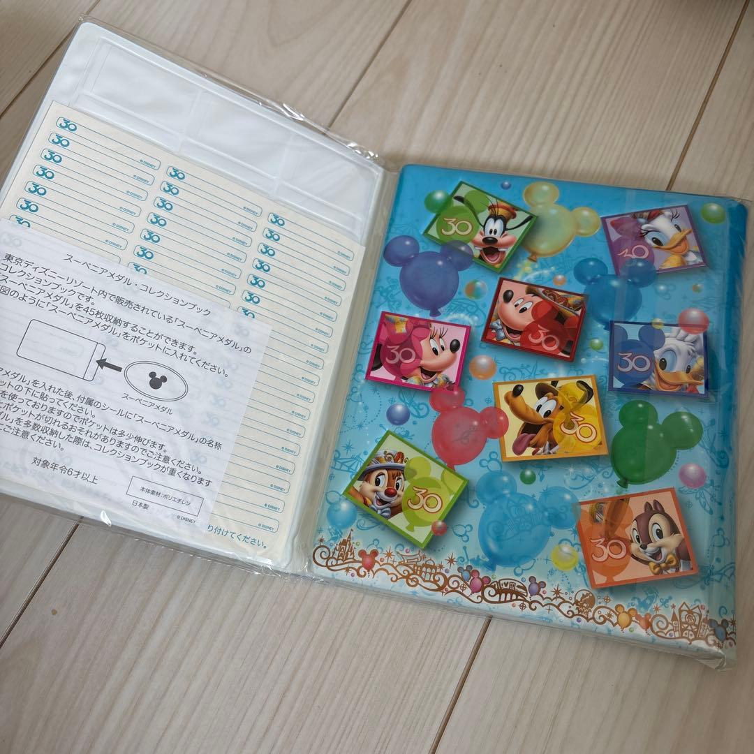 (新品)ディズニーリゾート35周年 メダルコレクションブック スーベニアメダル